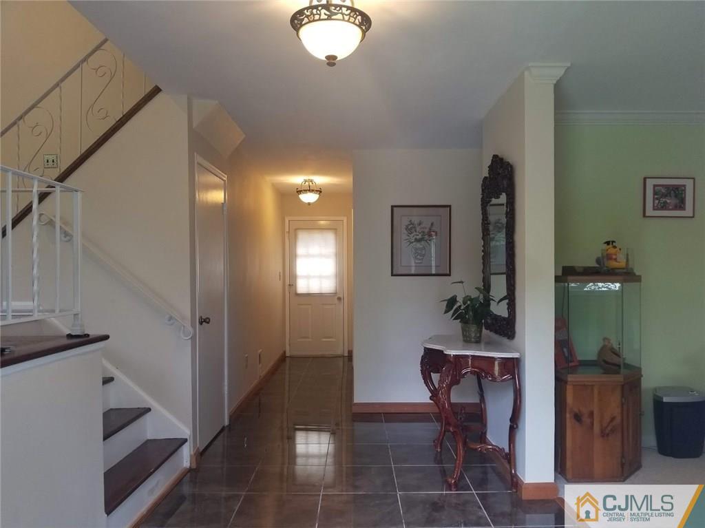 30 Agate Road East Brunswick, NJ 08816 - Photo 3 of 40 a view of a hallway with furniture and a livingroom