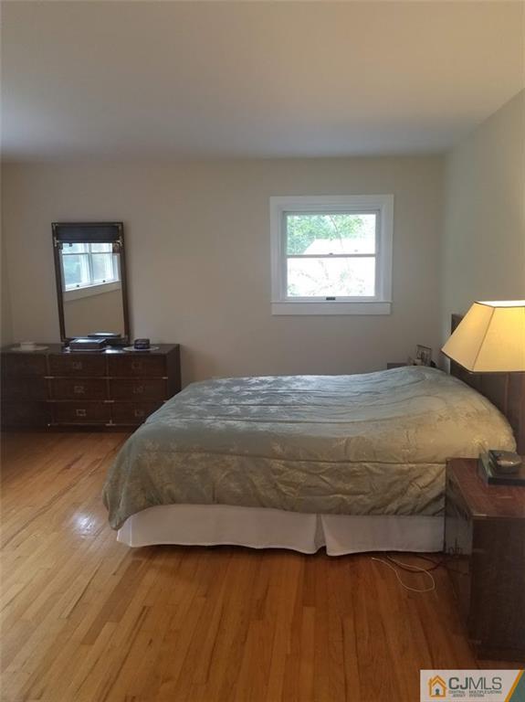 30 Agate Road East Brunswick, NJ 08816 - Photo 24 of 40 a bedroom with a bed and window