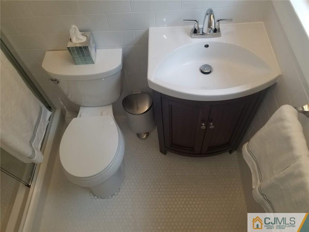 30 Agate Road East Brunswick, NJ 08816 - Photo 27 of 40 a bathroom with a sink and a mirror
