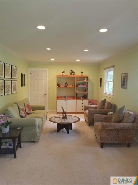 30 Agate Road East Brunswick, NJ 08816 - Photo 4 of 40 a living room with furniture and a large window