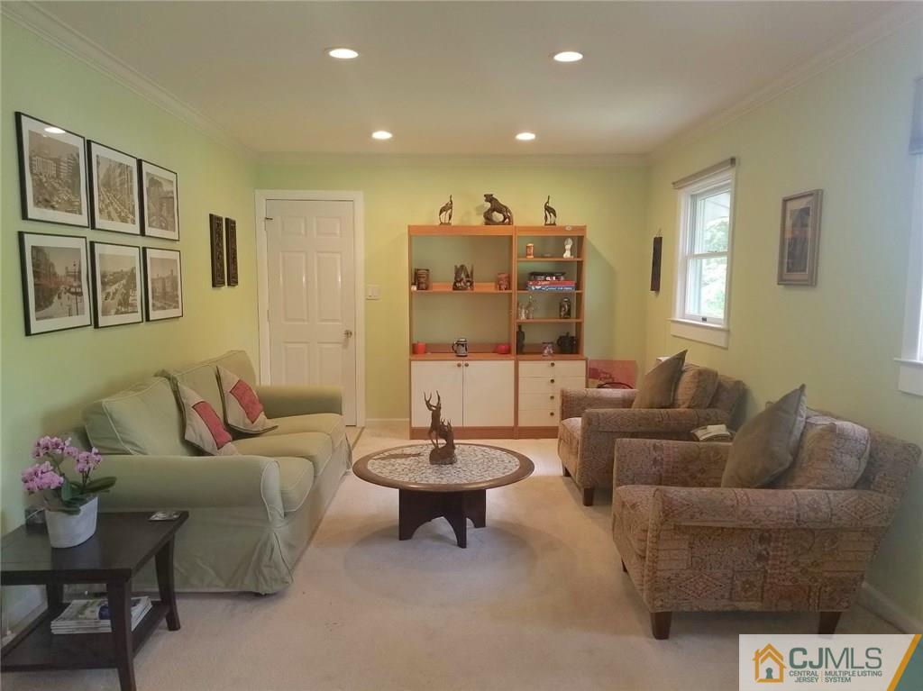 30 Agate Road East Brunswick, NJ 08816 - Photo 5 of 40 a living room with furniture and a large mirror