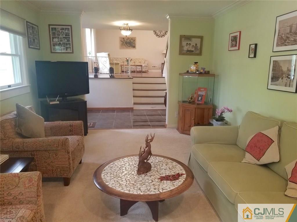 30 Agate Road East Brunswick, NJ 08816 - Photo 6 of 40 a living room with furniture and a wooden floor