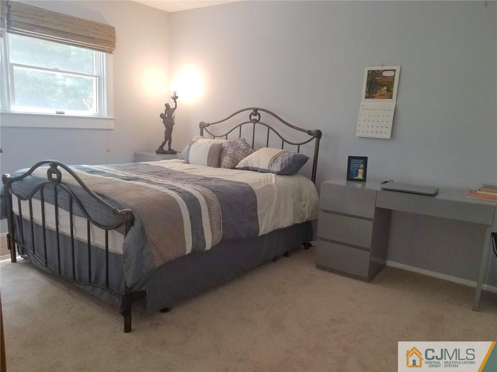 30 Agate Road East Brunswick, NJ 08816 - Photo 8 of 40 a bedroom with a bed and window
