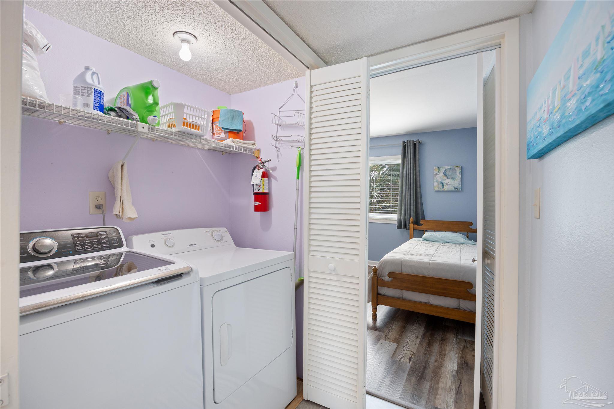 14100 River Road, Unit 228B Pensacola, FL 32507 - Photo 20 of 41 a utility room with dryer and washer