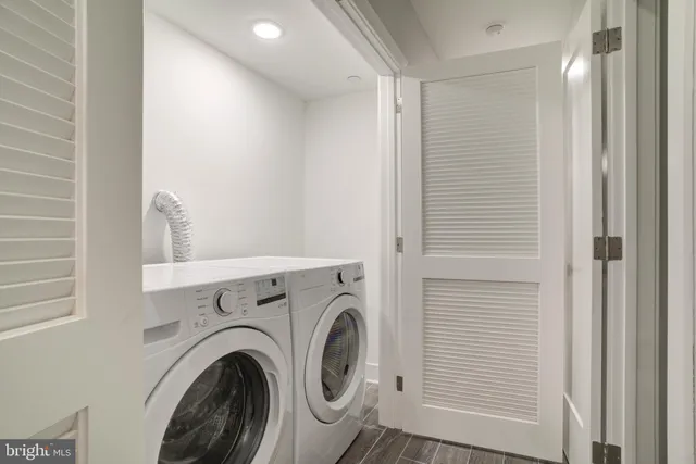 a view of storage and utility room with washer and dryer