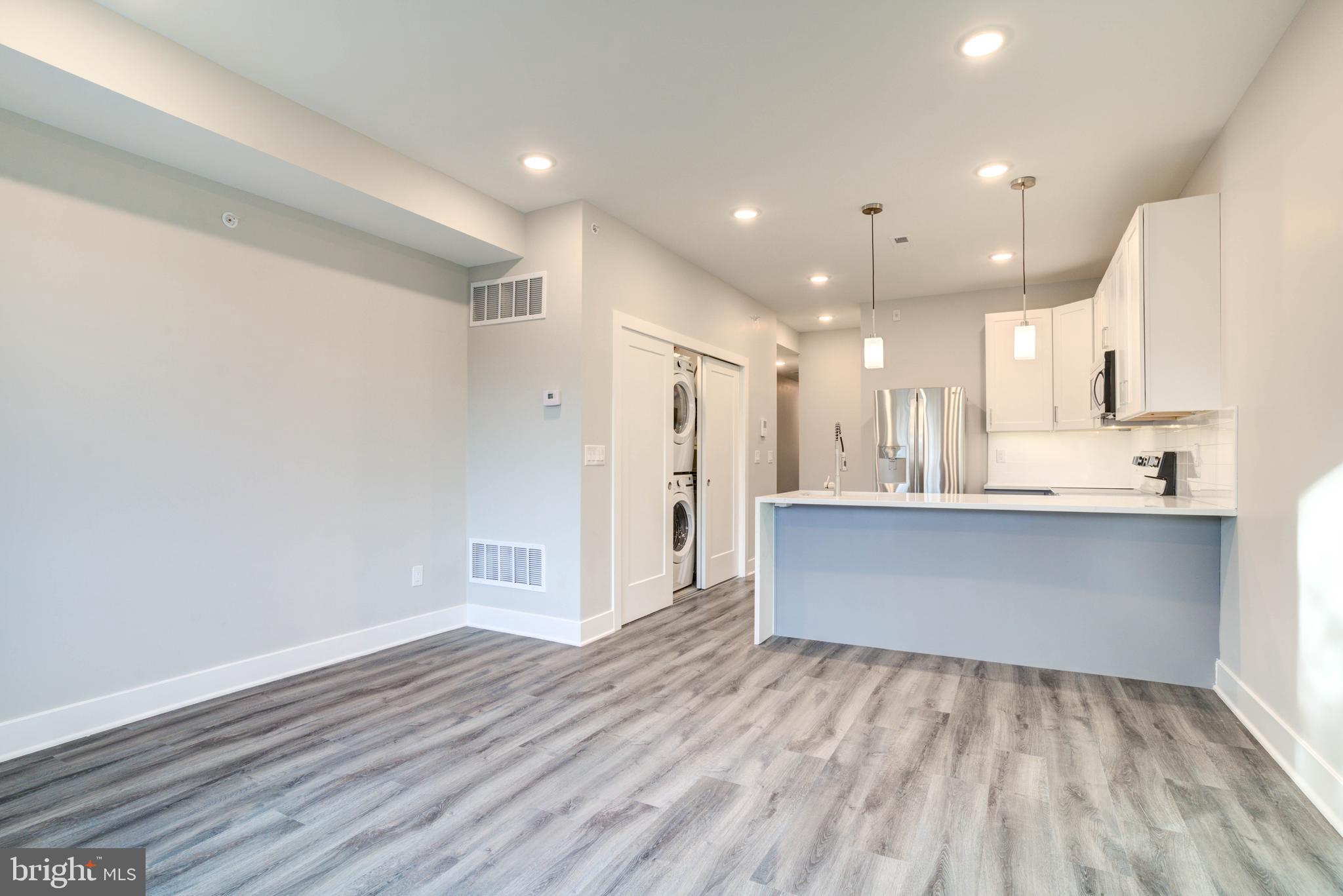 5005 Walnut Street Philadelphia, PA 19139 - Photo 18 of 39 a view of kitchen and kitchen with wooden floor