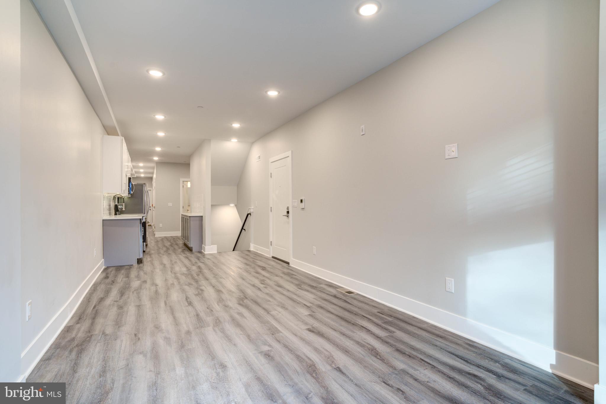5005 Walnut Street Philadelphia, PA 19139 - Photo 5 of 39 a view of a living room with wooden floor