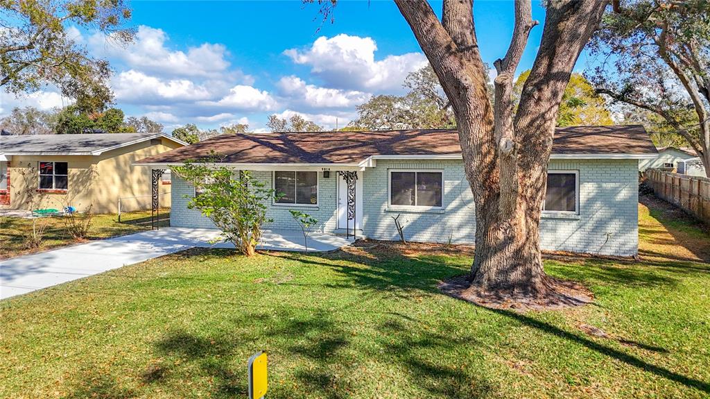 9614 Oakridge Avenue Riverview, FL 33578 - Photo 1 of 1 a view of a house with a yard