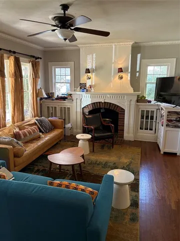 a living room with furniture and a fireplace