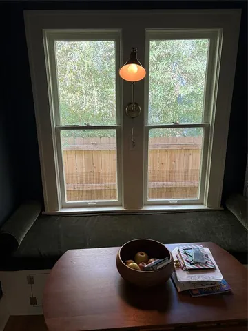 a close view of a sink and a table in a window
