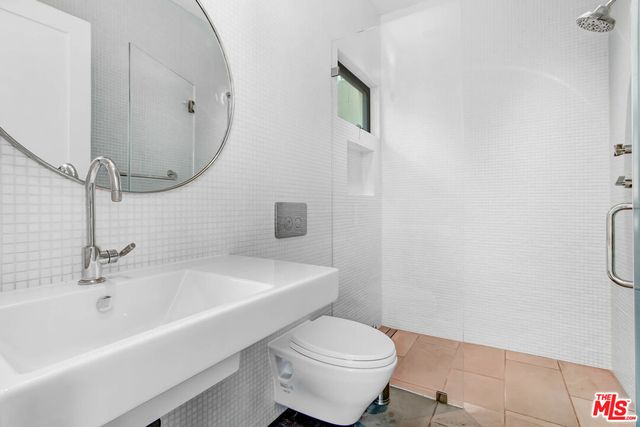 a bathroom with a sink a toilet and bathtub