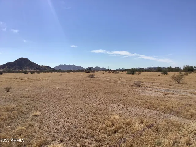 a view of lake with mountain in the background