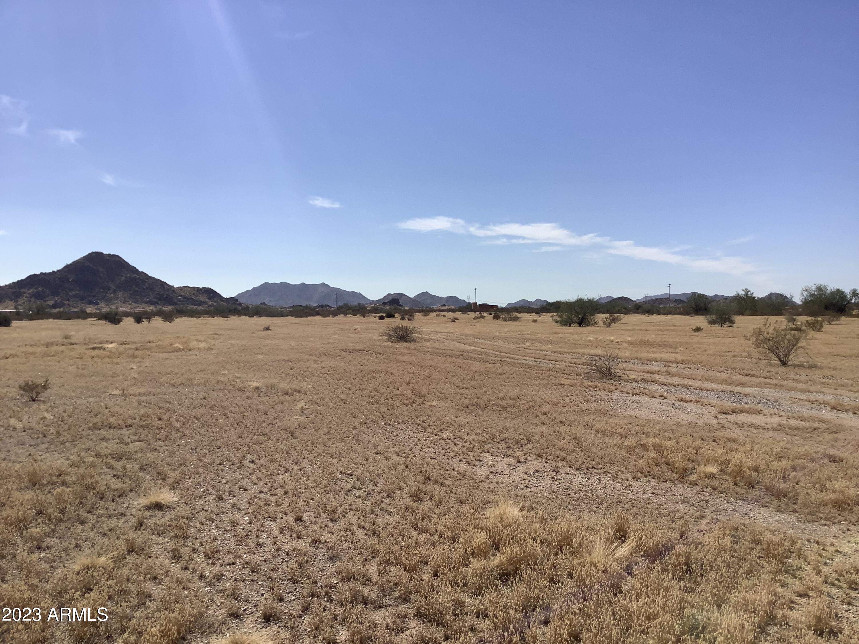 3 Horizon Ranch, Unit 3 Buckeye, AZ 85326 - Photo 8 of 12 a view of lake with mountain in the background
