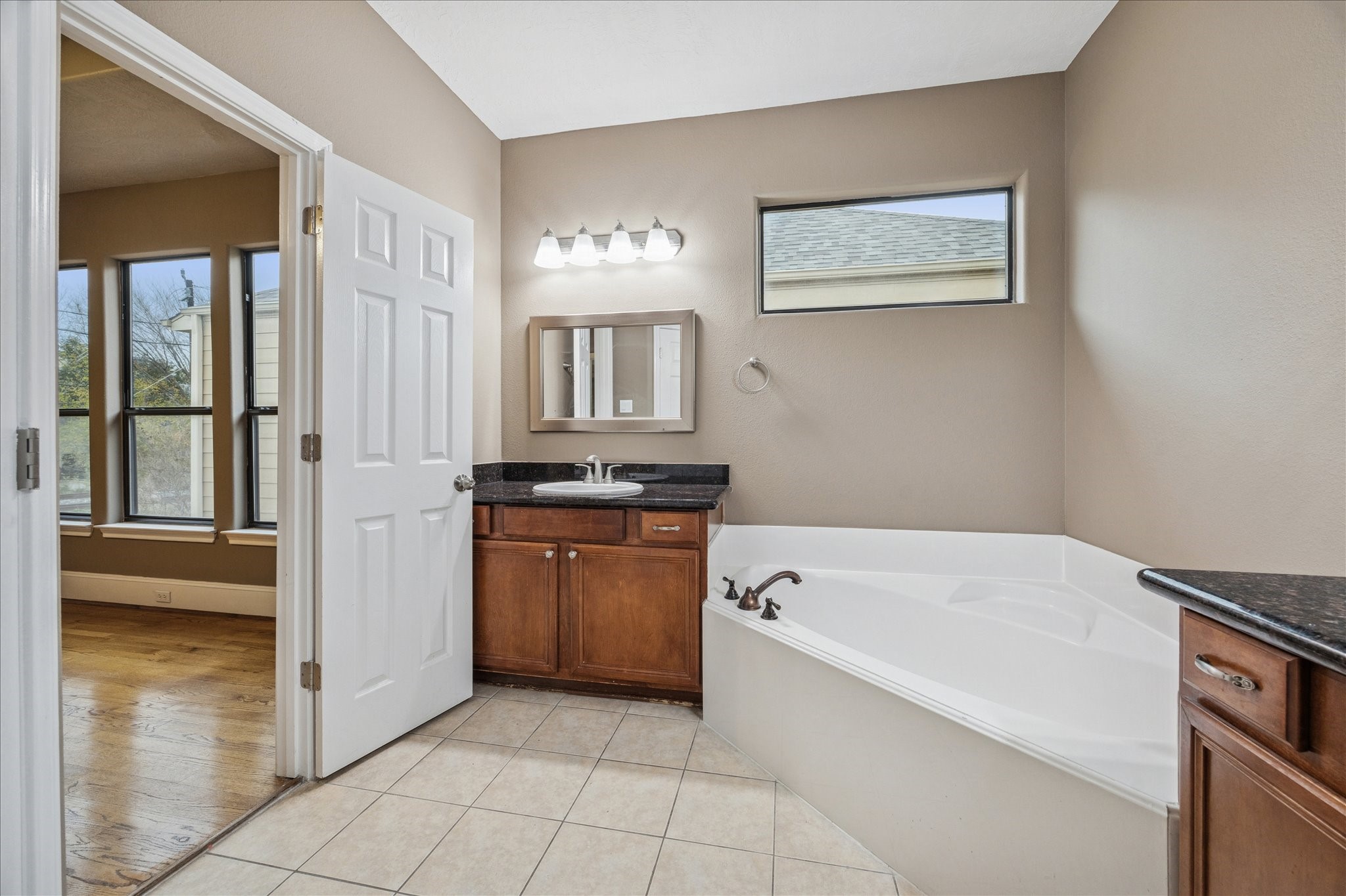 1376 Studer Street Houston, TX 77007 - Photo 17 of 38 a bathroom with a tub sink and a window