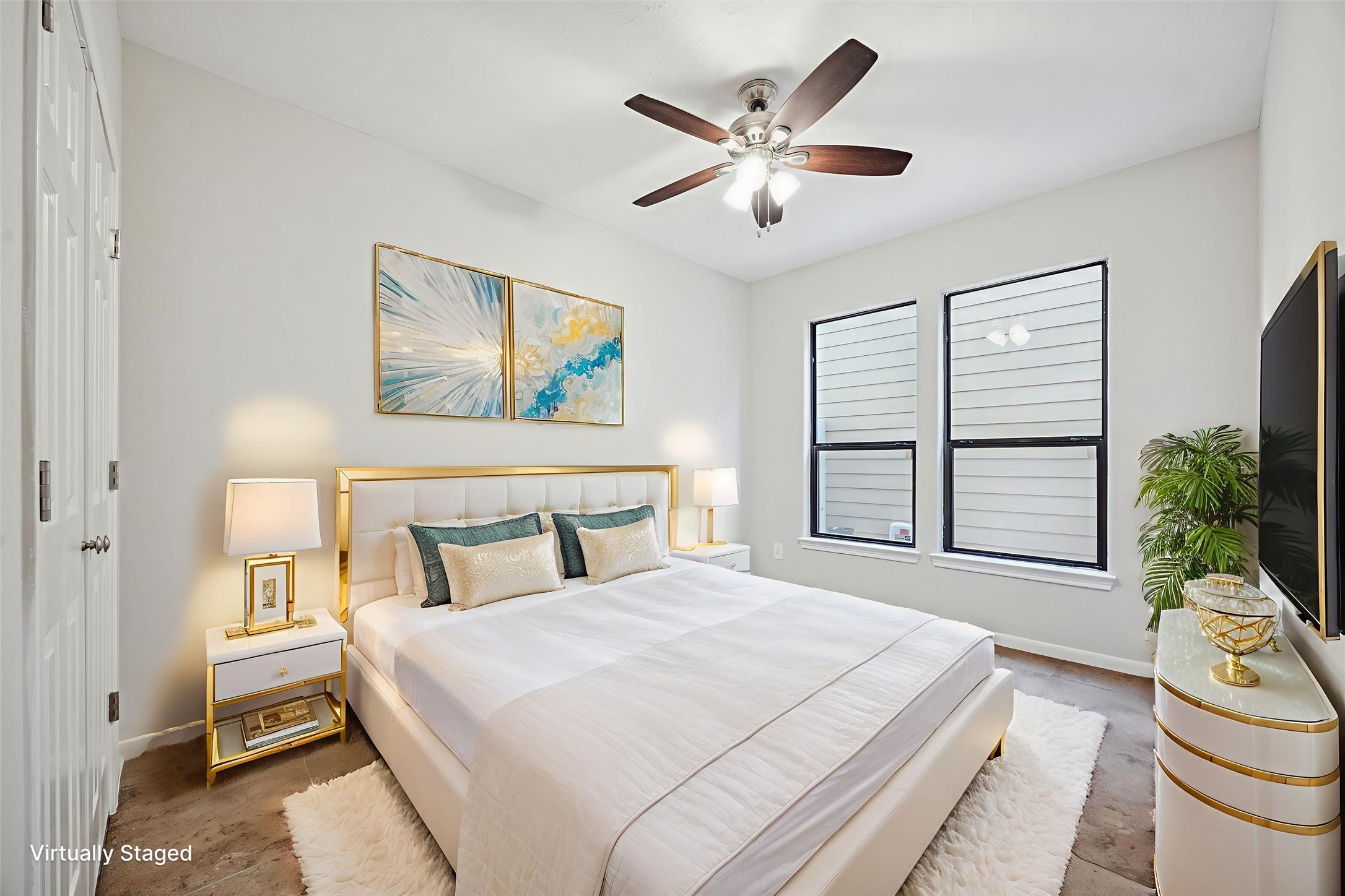 1376 Studer Street Houston, TX 77007 - Photo 27 of 38 a bedroom with a large bed and a chandelier