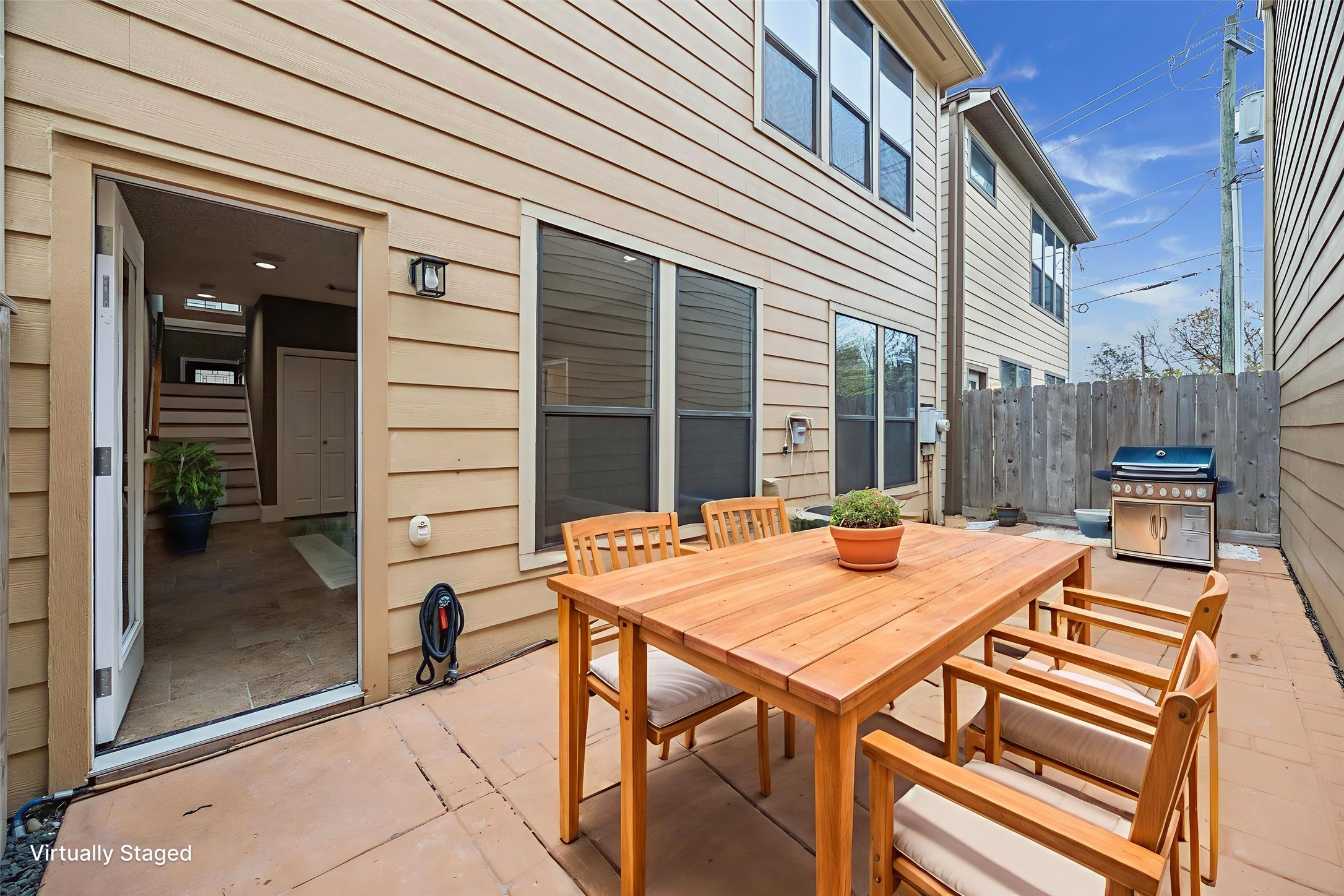 1376 Studer Street Houston, TX 77007 - Photo 29 of 38 a view of a patio with a table and chairs