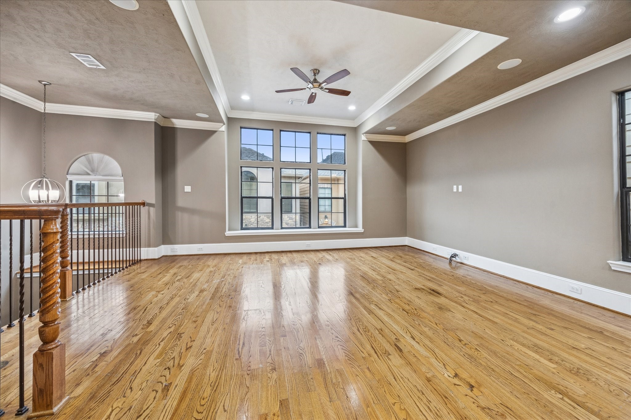 1376 Studer Street Houston, TX 77007 - Photo 4 of 38 wooden floor in an empty room with a window