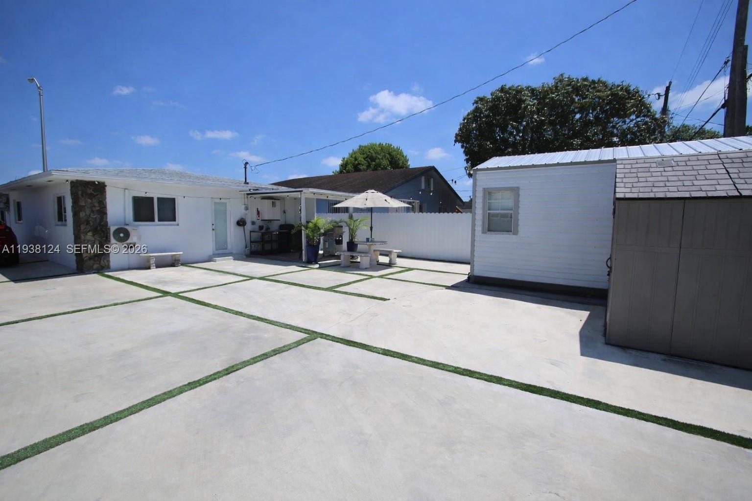 798 West 31st Street Hialeah, FL 33012 - Photo 1 of 15 a view of a house with a patio