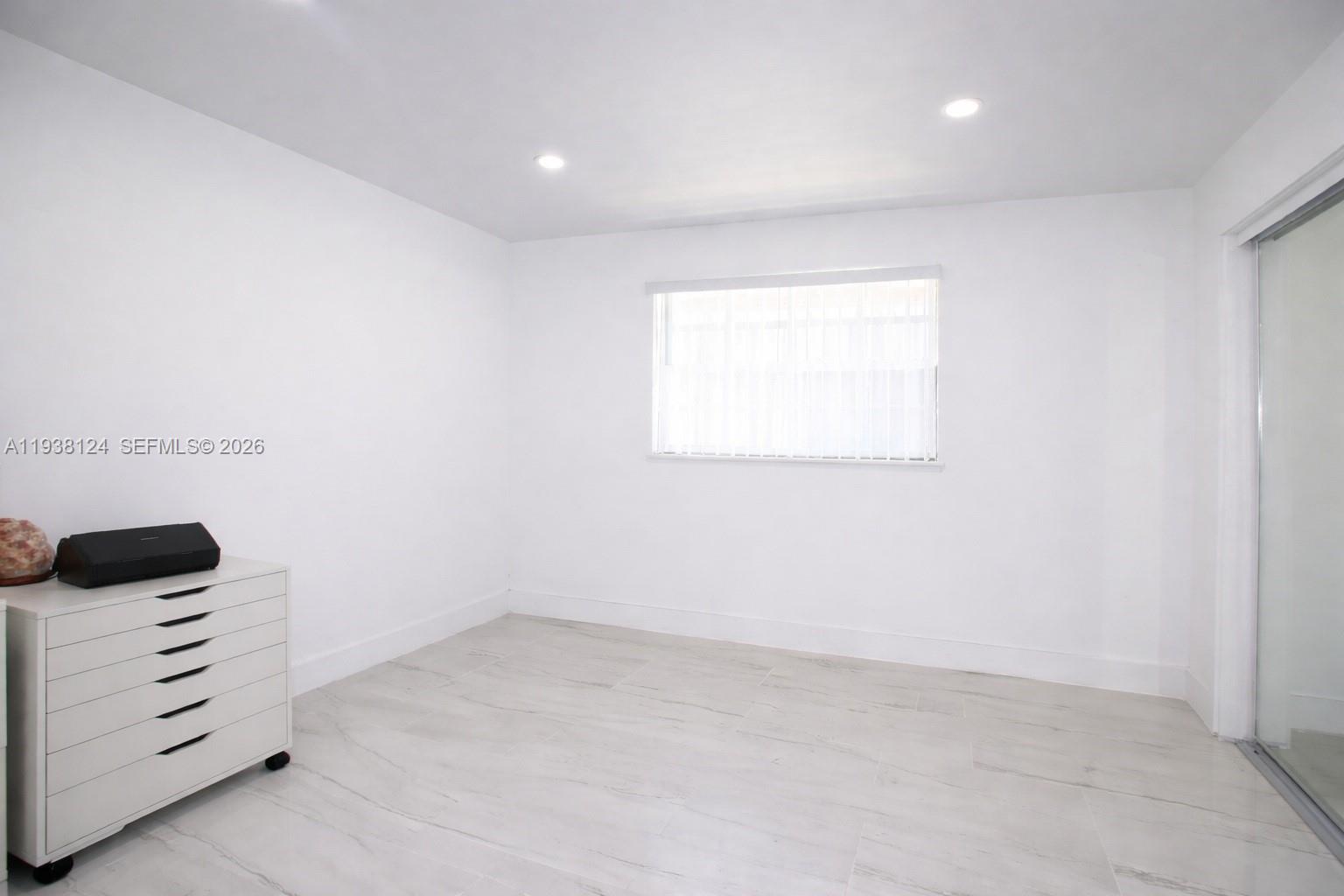 798 West 31st Street Hialeah, FL 33012 - Photo 11 of 15 an empty room with a window