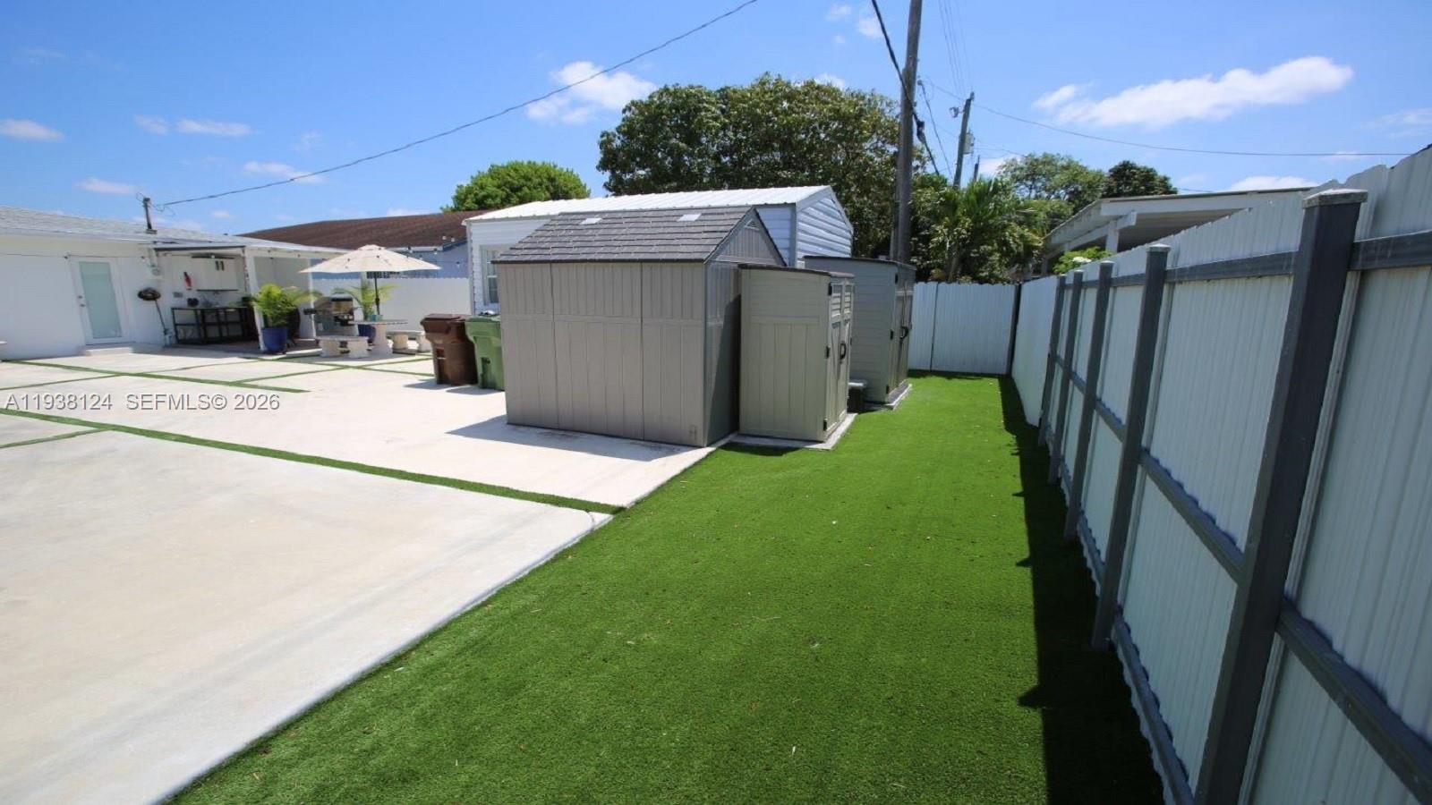 798 West 31st Street Hialeah, FL 33012 - Photo 12 of 15 a view of a backyard with pathway