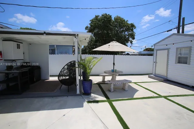 an aerial view of a house with a swimming pool