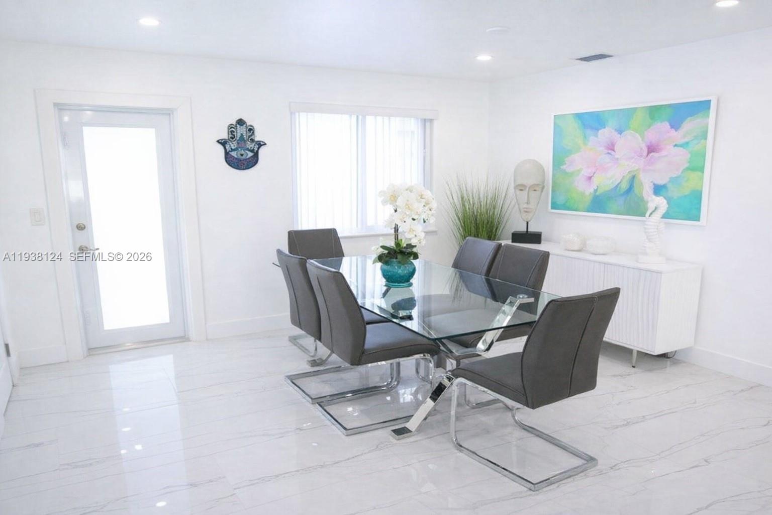 798 West 31st Street Hialeah, FL 33012 - Photo 5 of 15 a view of a livingroom with furniture and a window