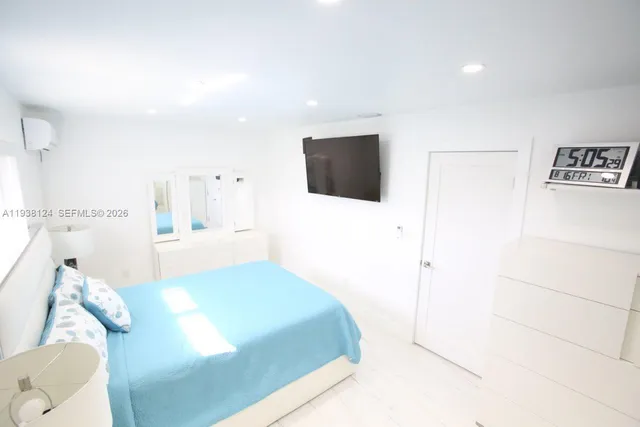 a bathroom with a toilet and a bath tub