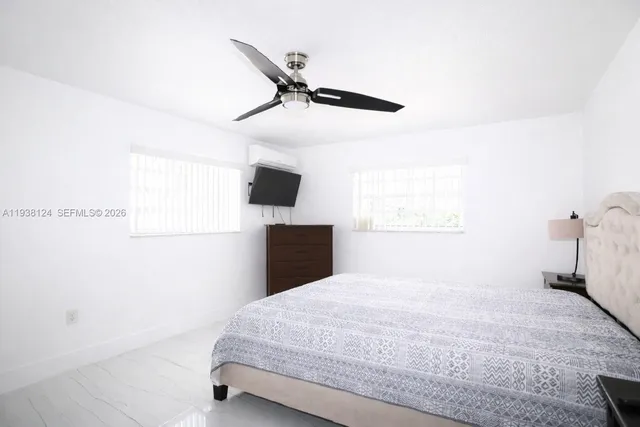 a view of an empty walk in closet with wooden floor