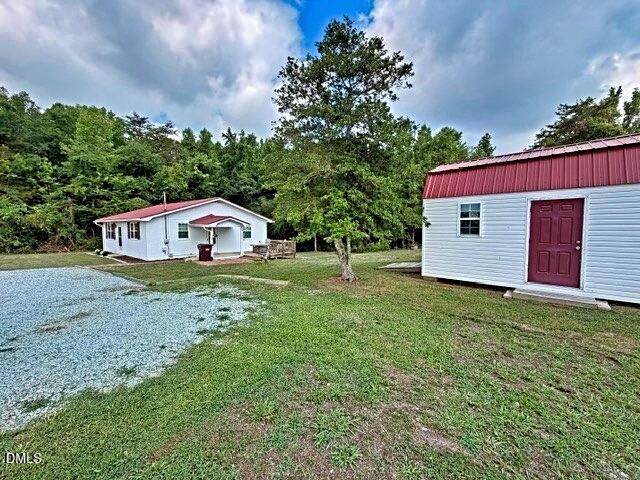 3555 Antioch Church Road Timberlake, NC 27583 - Photo 5 of 19 3555 side yard with building (1)