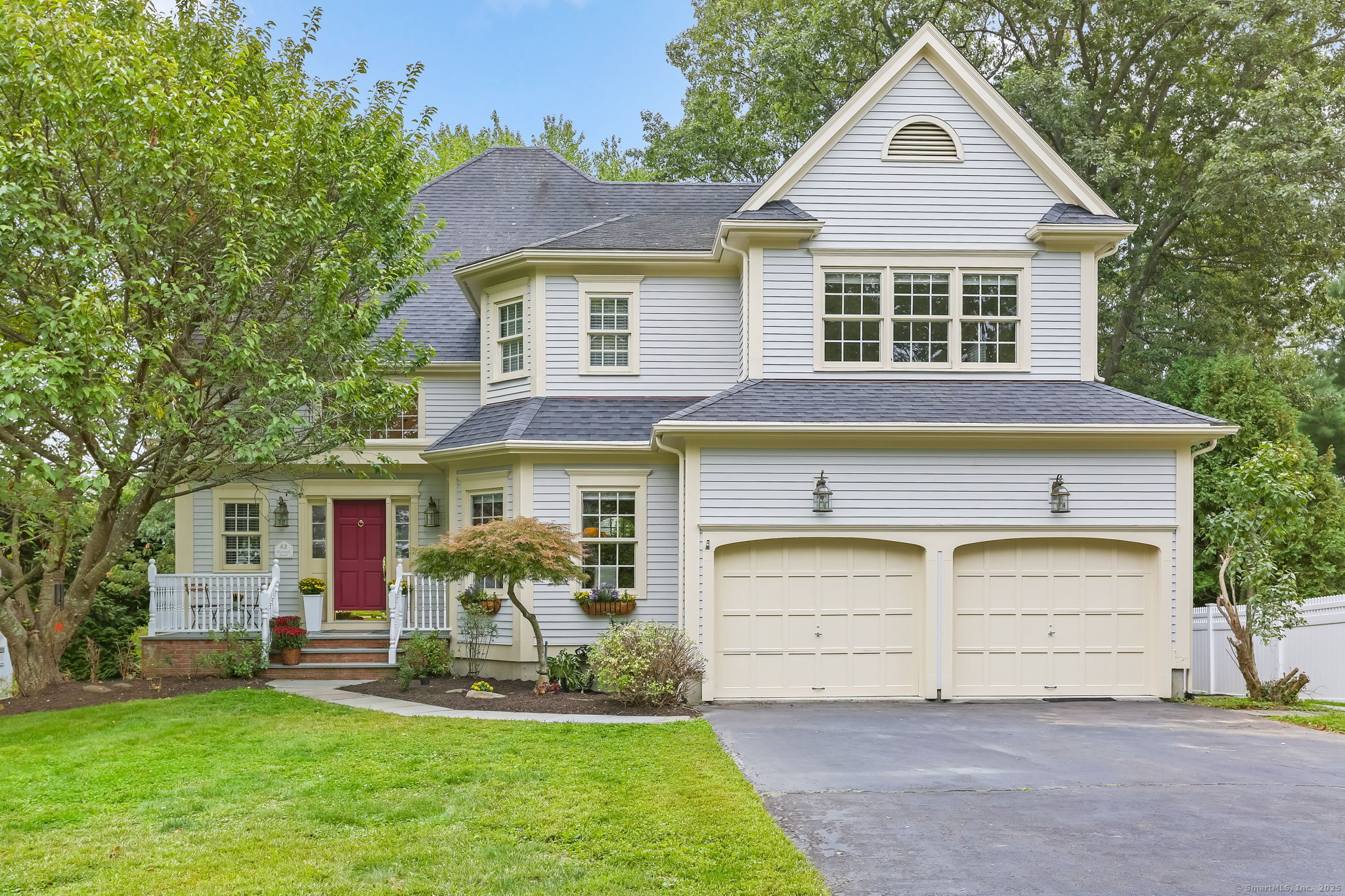 83 Mailands Road Fairfield, CT 06824 - Photo 1 of 1 a front view of a house with a yard and garage