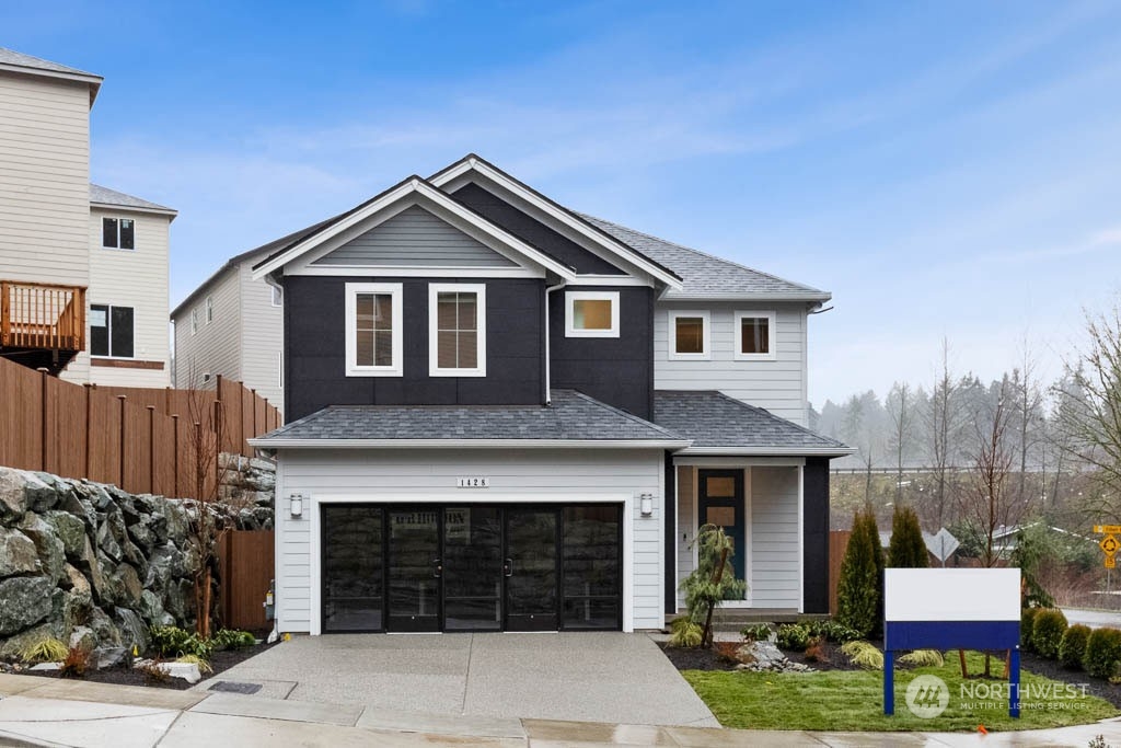 4202 163rd Street Southeast Bothell, WA 98012 - Photo 1 of 34 a front view of a house with garden
