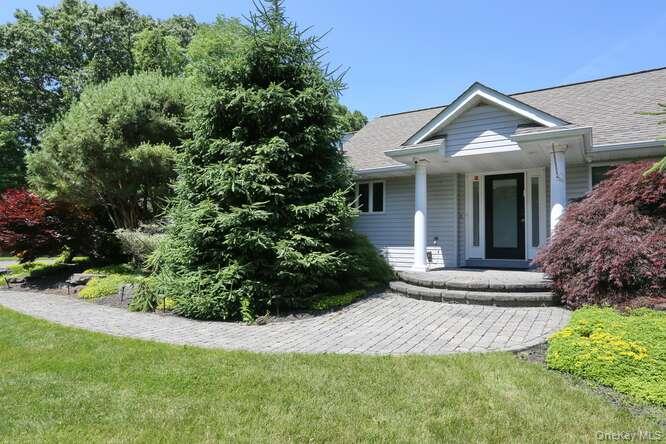 89 Spook Rock Road Suffern, NY 10901 - Photo 3 of 44 front view of a house with a yard