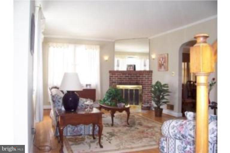 612 Anneslie Road Baltimore, MD 21212 - Photo 4 of 19 a living room with furniture and a fireplace