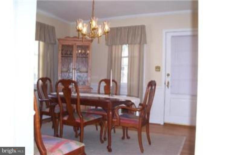 612 Anneslie Road Baltimore, MD 21212 - Photo 7 of 19 a dining room with furniture and chandelier