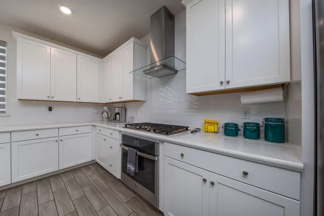 a bedroom with a bed and a ceiling fan