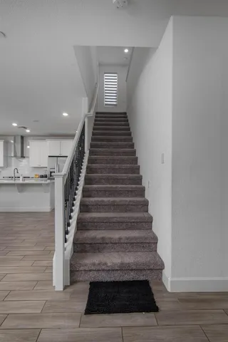a bathroom with a tub a sink and a shower