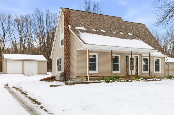 a front view of a house with yard