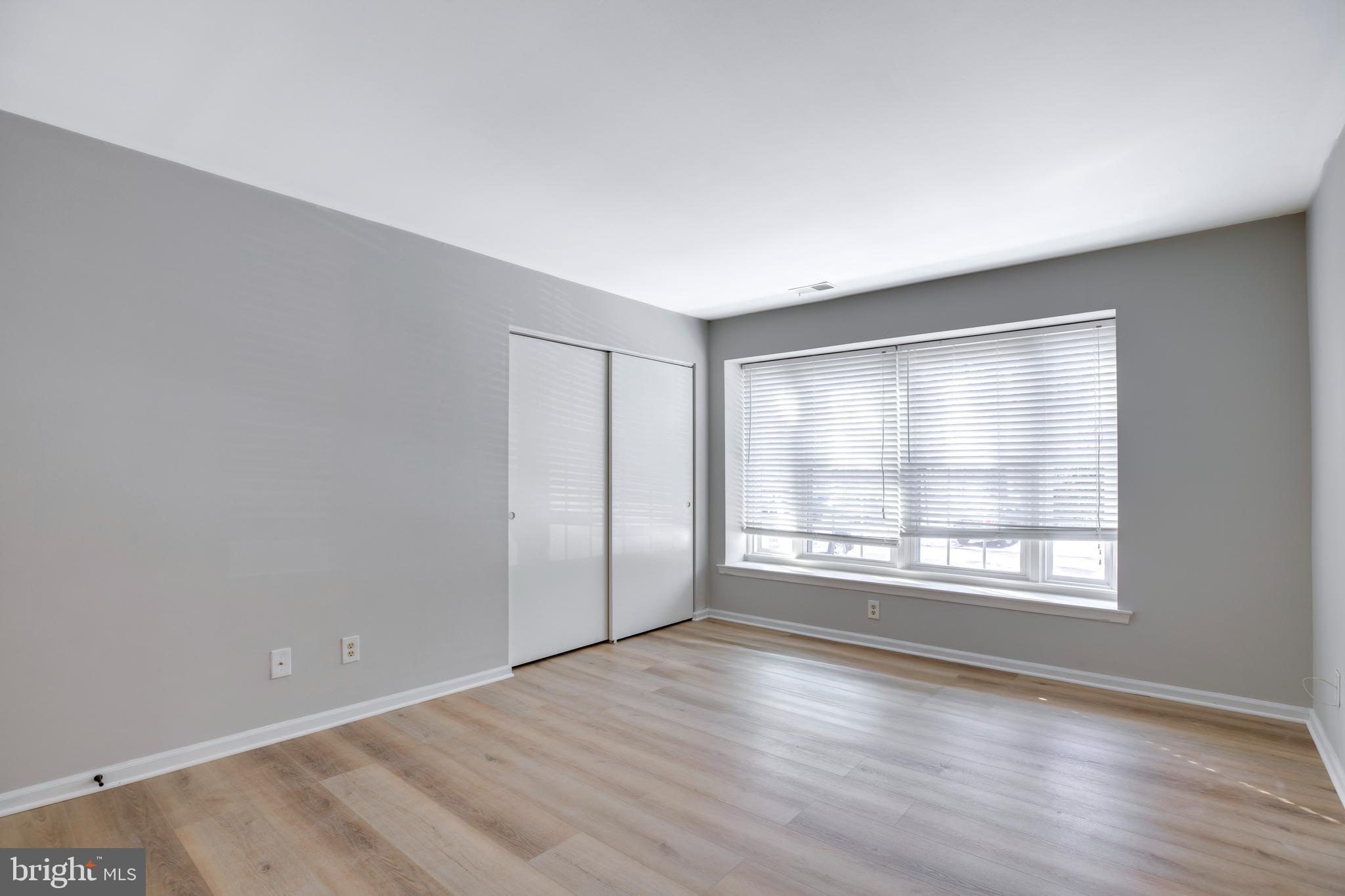 11172 Beaver Trail Court Reston, VA 20191 - Photo 14 of 26 an empty room with wooden floor and windows