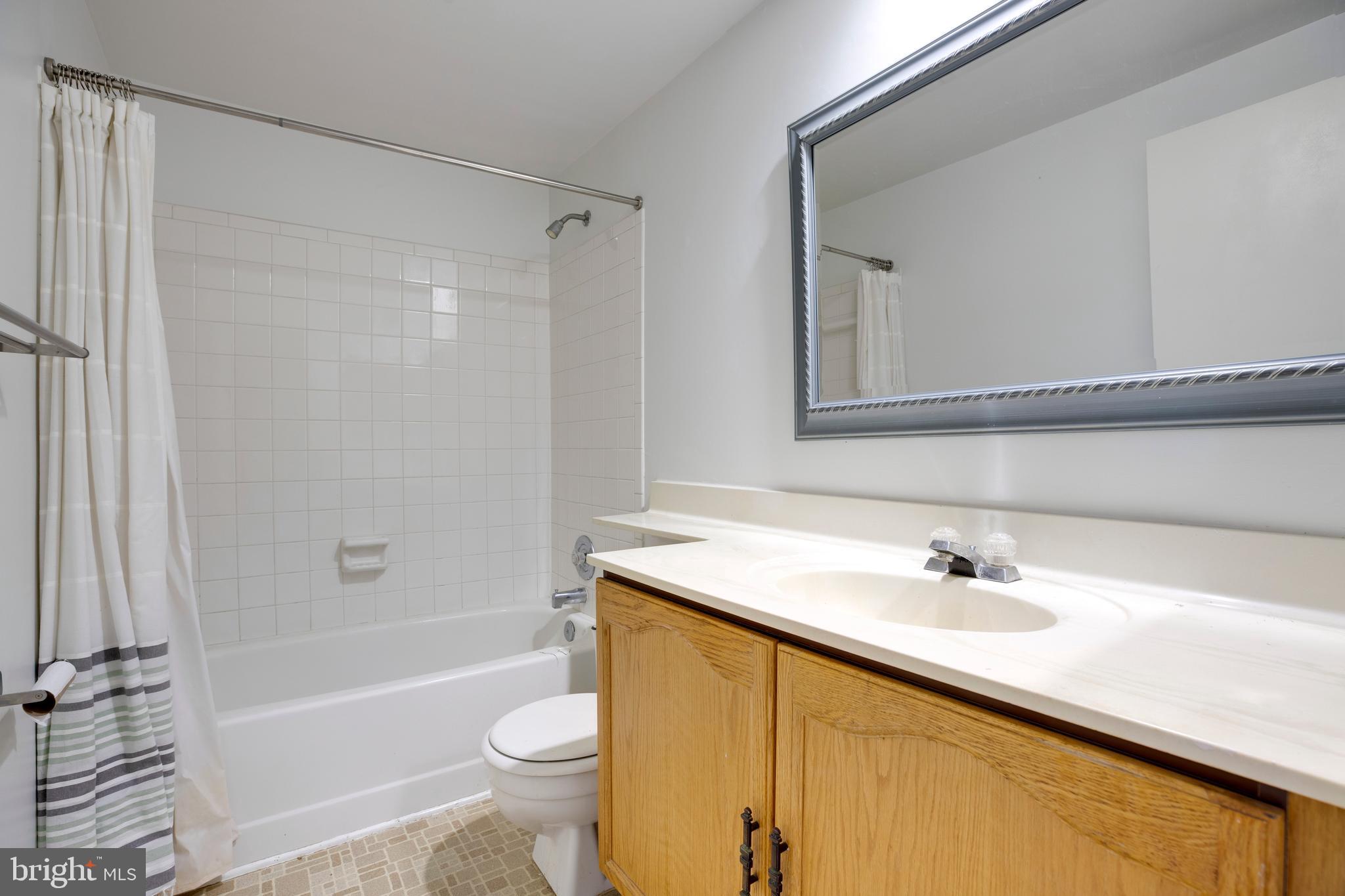 11172 Beaver Trail Court Reston, VA 20191 - Photo 17 of 26 a bathroom with a sink a toilet and a bathtub