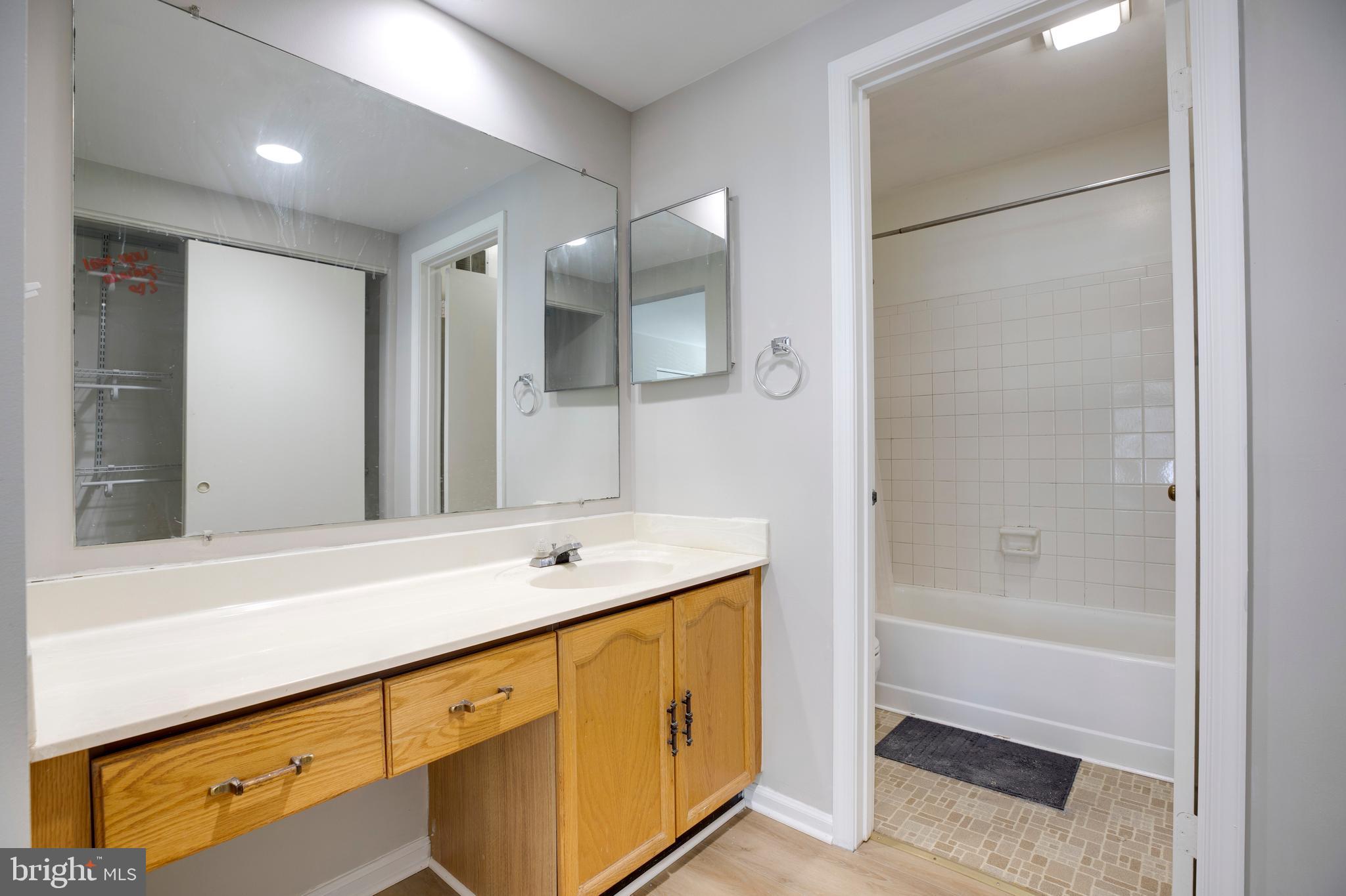 11172 Beaver Trail Court Reston, VA 20191 - Photo 18 of 26 a spacious bathroom with a shower sink and mirror