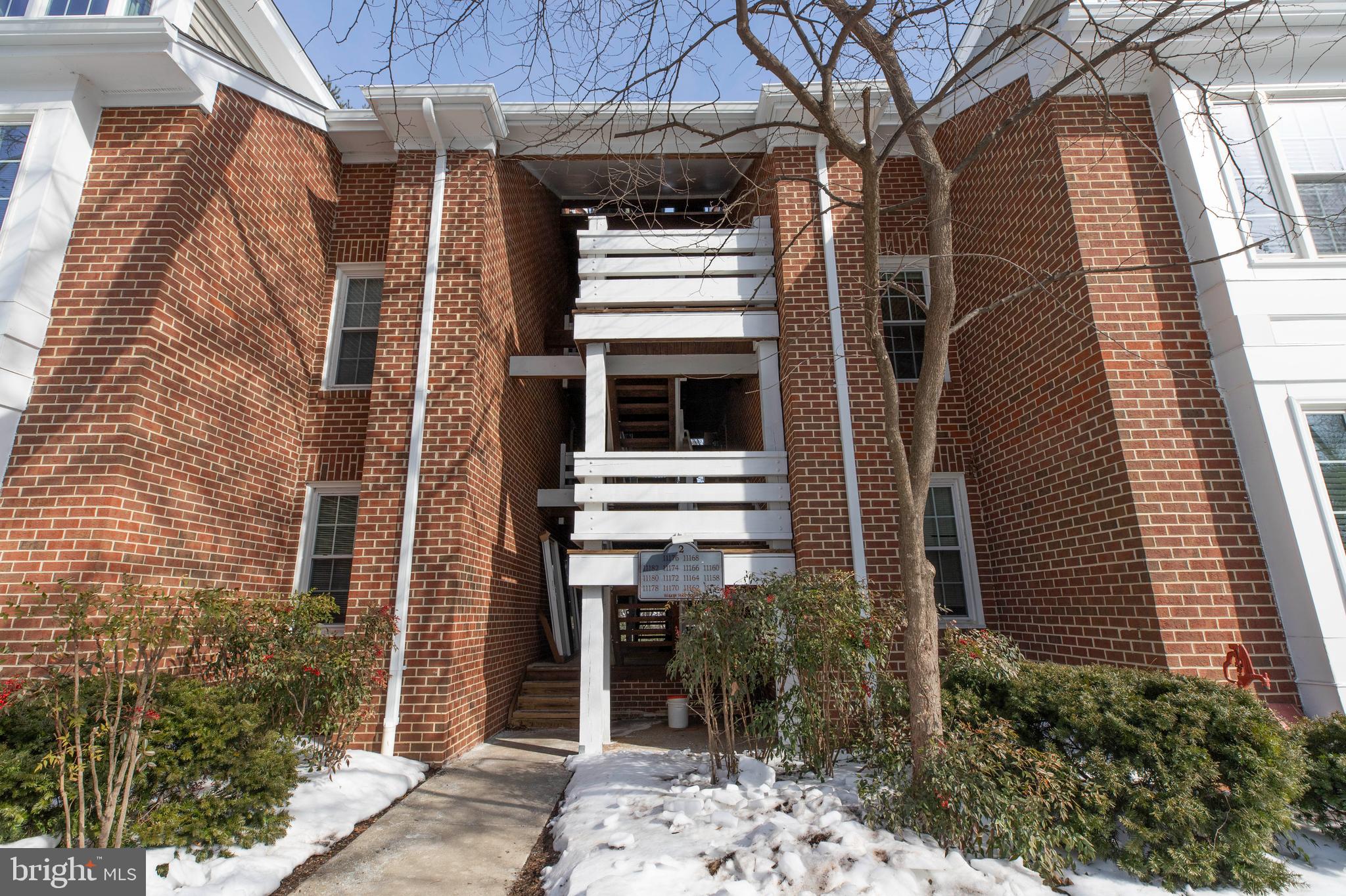 11172 Beaver Trail Court Reston, VA 20191 - Photo 2 of 26 a front view of a house with a yard