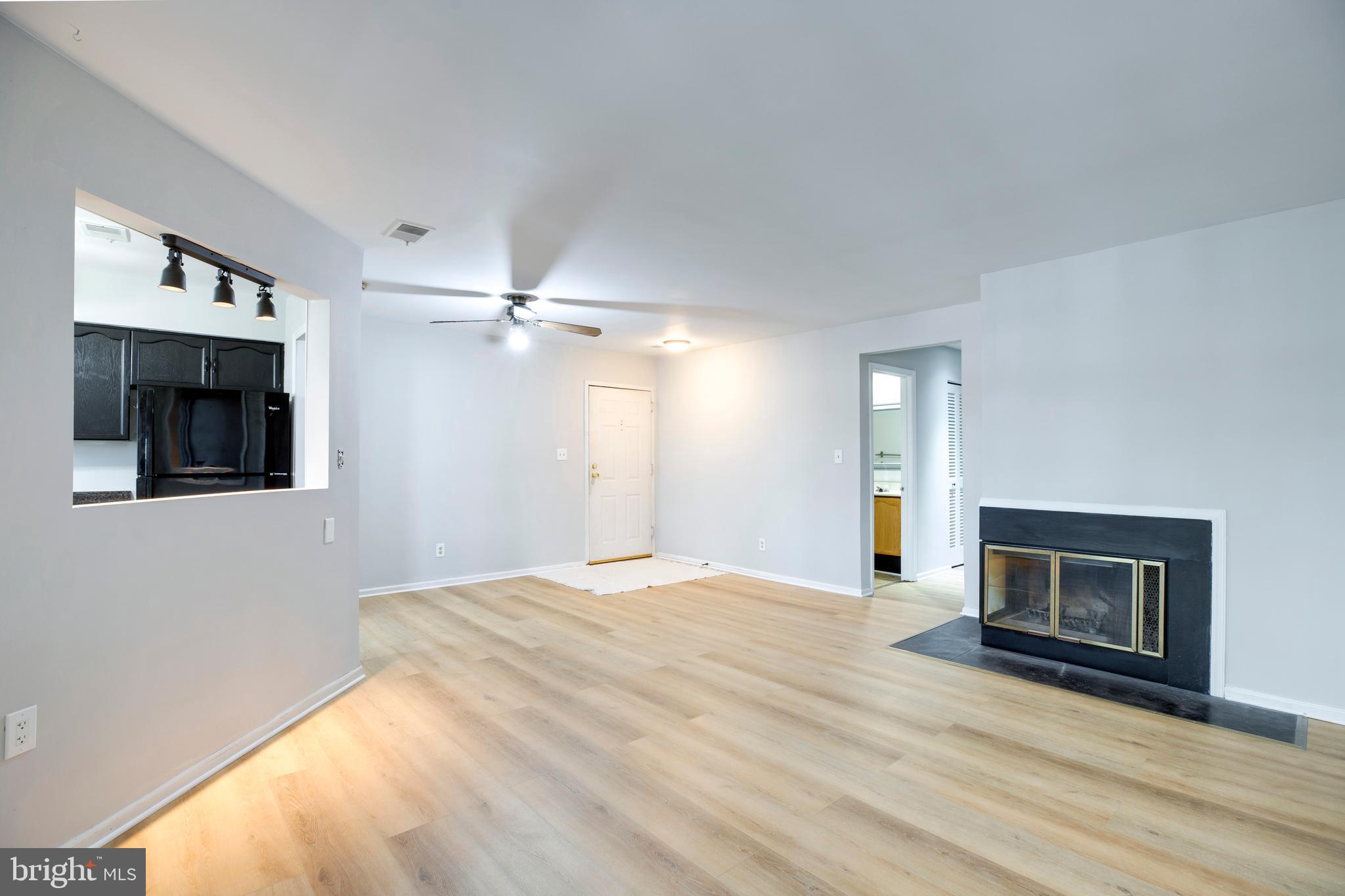11172 Beaver Trail Court Reston, VA 20191 - Photo 5 of 26 a view of empty room with a fireplace and fan