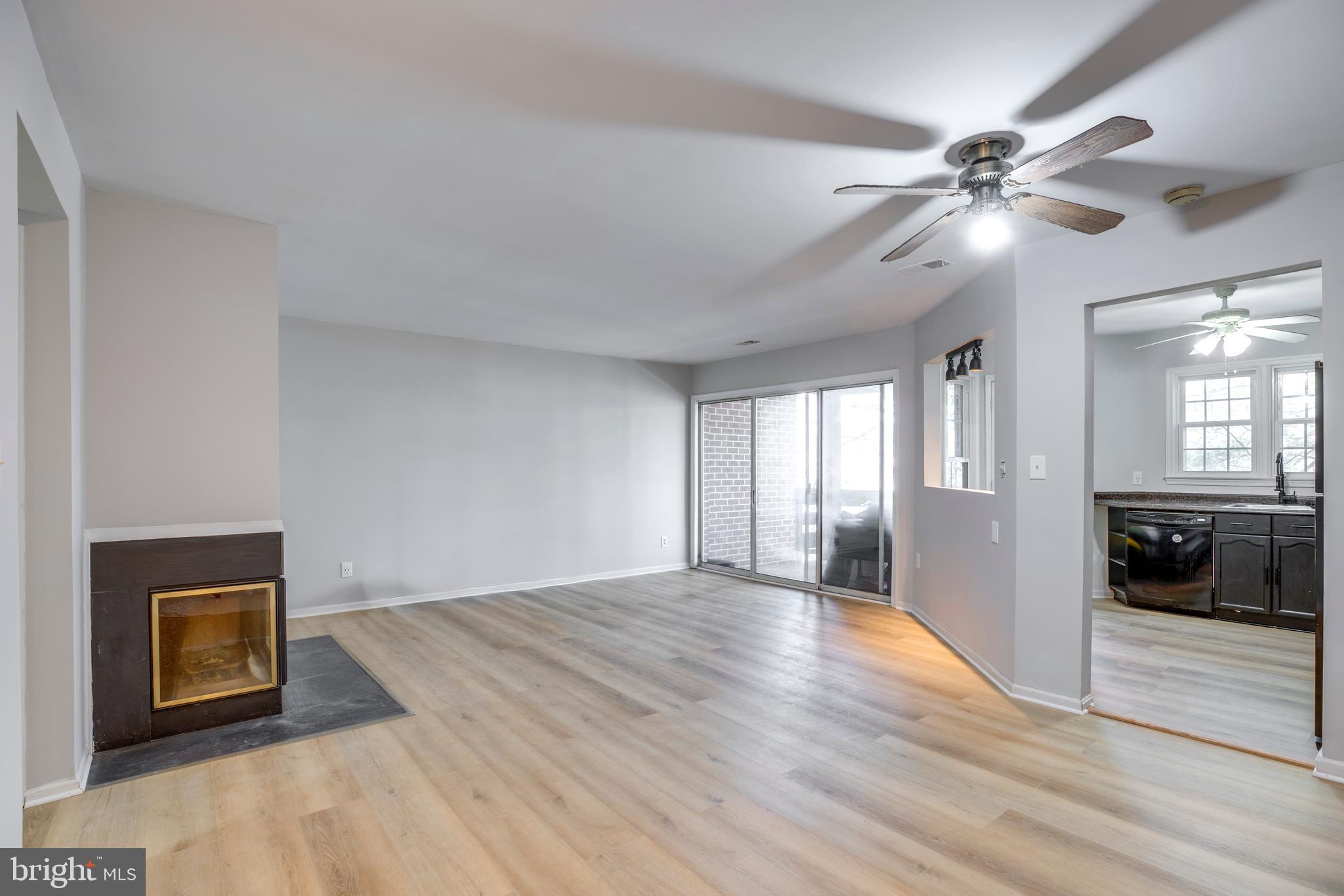11172 Beaver Trail Court Reston, VA 20191 - Photo 6 of 26 a view of an empty room and window with wooden floor