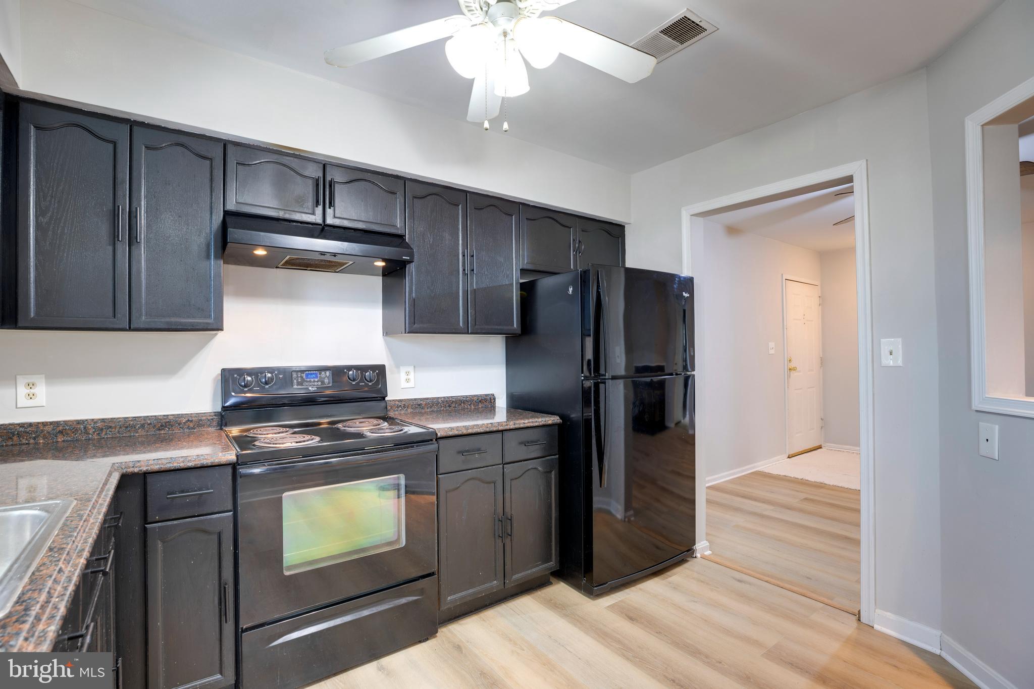 11172 Beaver Trail Court Reston, VA 20191 - Photo 10 of 26 a kitchen with a stove and a refrigerator