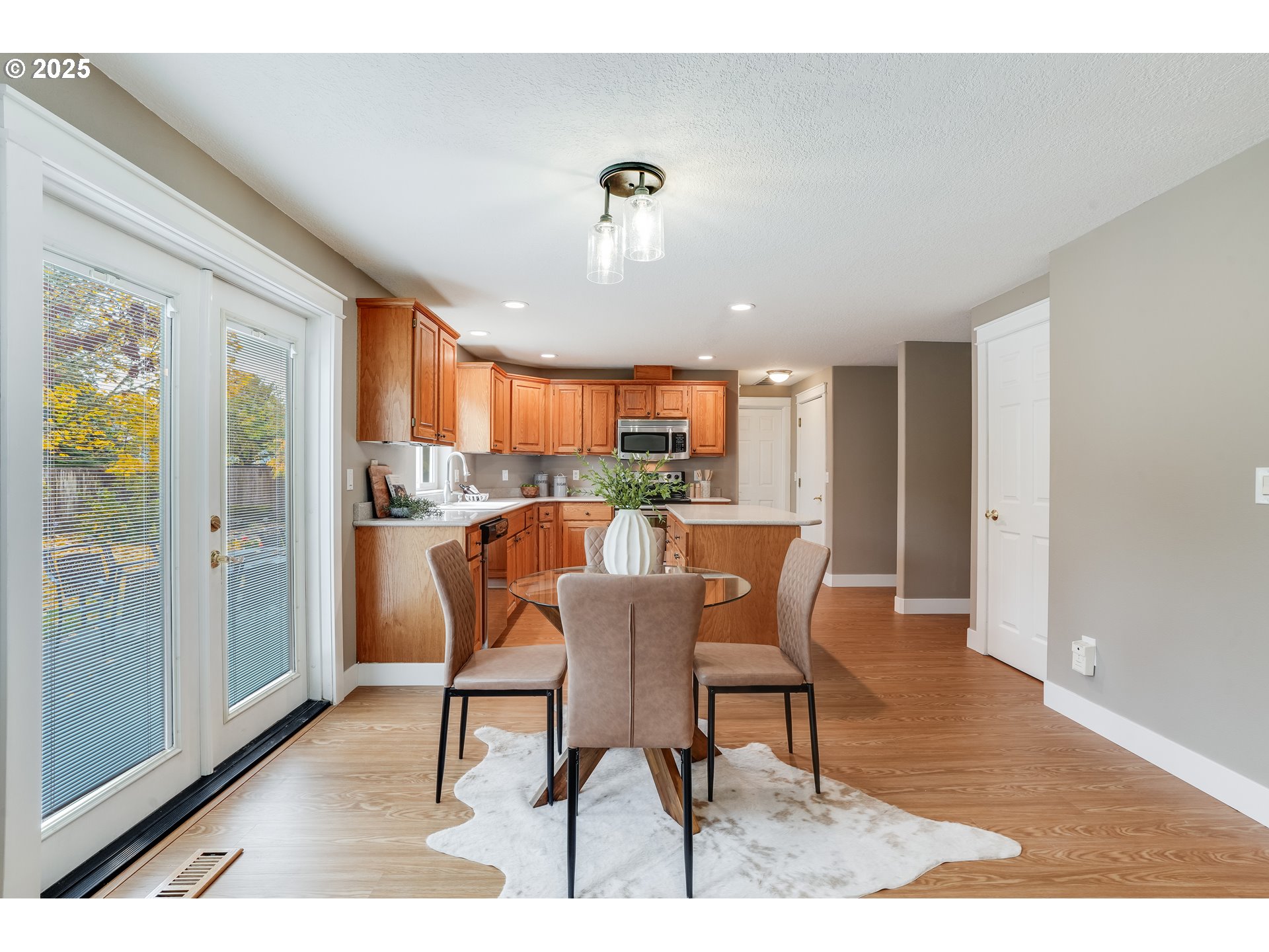 1224 Alyssum Avenue Forest Grove, OR 97116 - Photo 12 of 39 a view of a dining room with furniture window and wooden floor