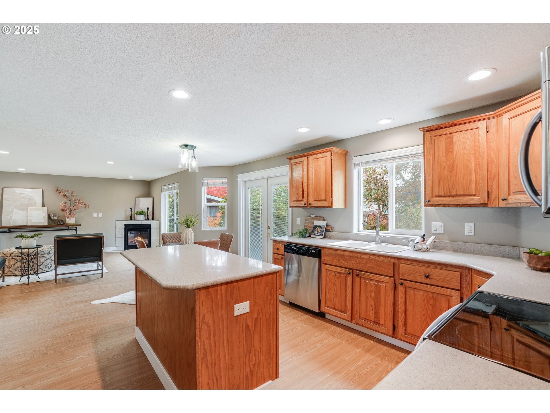 1224 Alyssum Avenue Forest Grove, OR 97116 - Photo 14 of 39 a kitchen with granite countertop a sink stove and cabinets