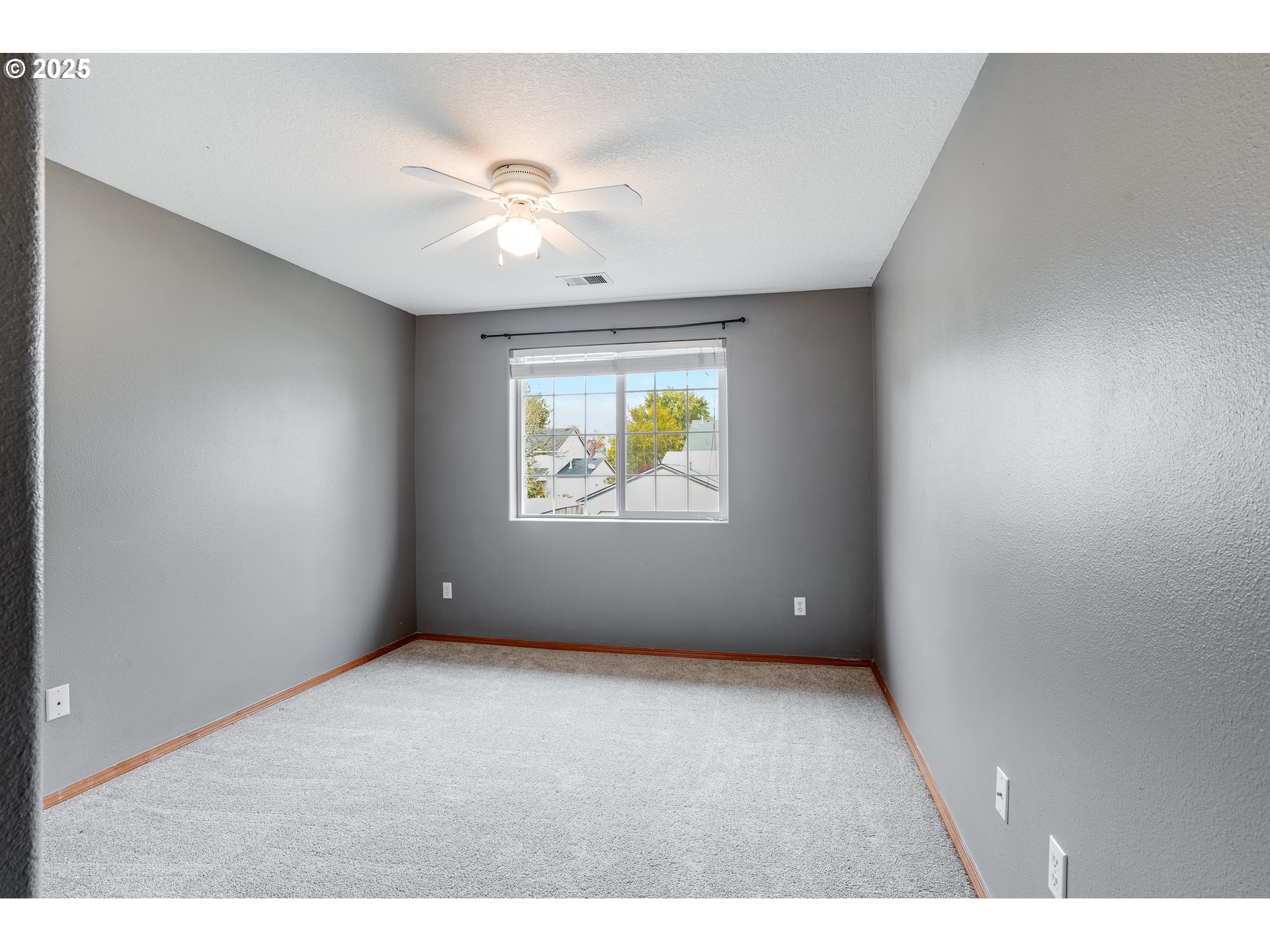 1224 Alyssum Avenue Forest Grove, OR 97116 - Photo 29 of 39 a view of an empty room with window and chandelier fan