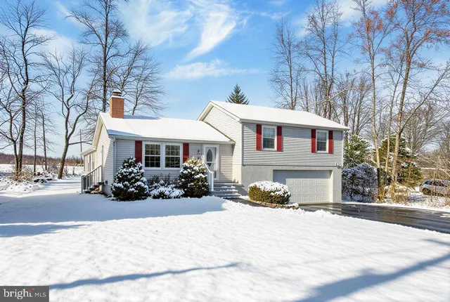 a view of a dining room with furniture wooden floor and chandelier