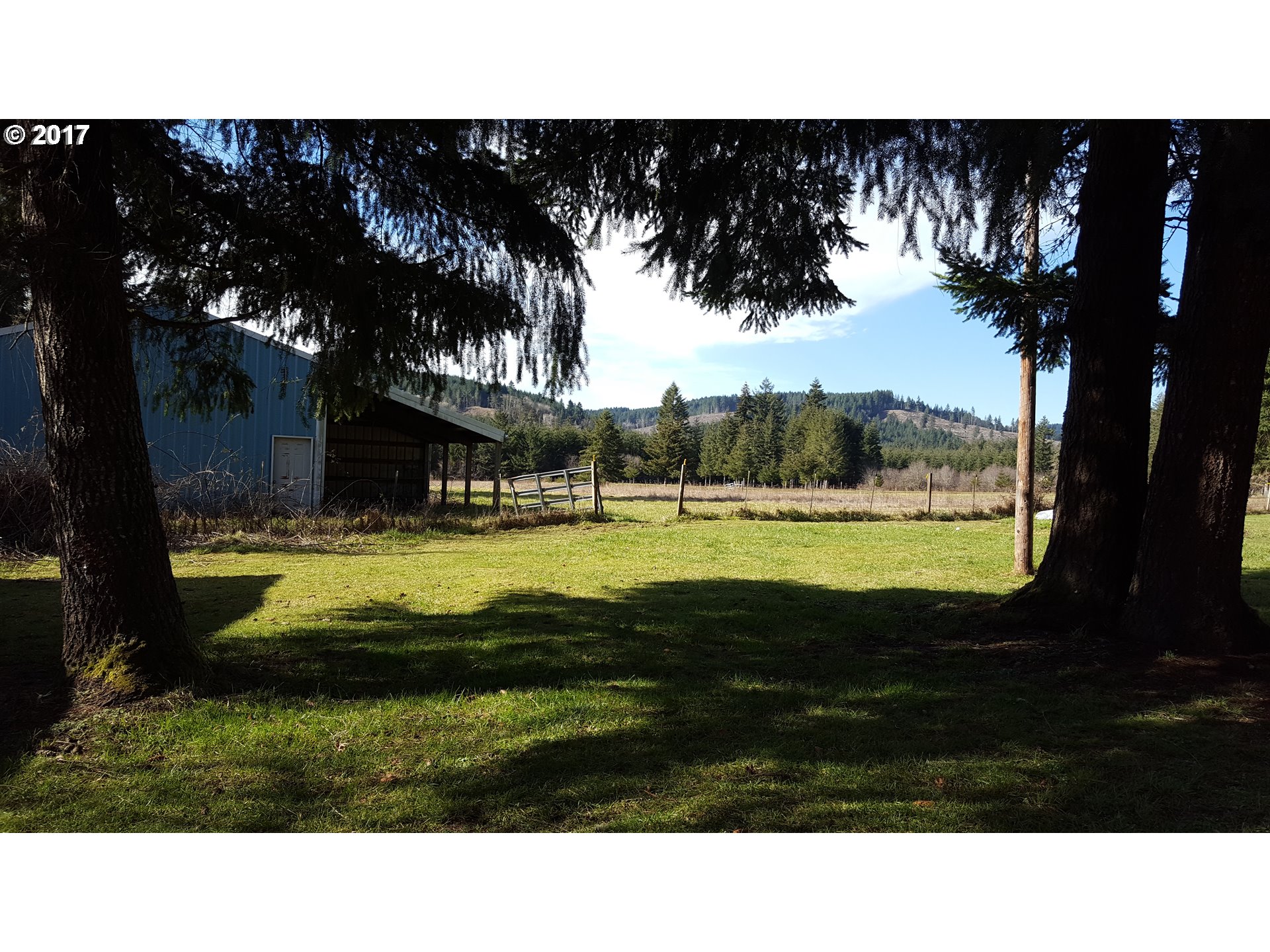 22960 Southwest Grand Ronde Road Grand Ronde, OR 97347 - Photo 5 of 25 a view of a swimming pool with an outdoor space and seating area