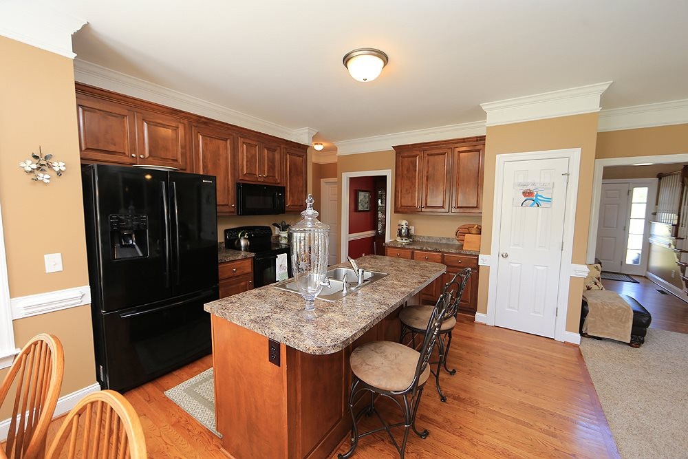 214 Steve Ridge Willow Spring, NC 27592 - Photo 12 of 29 To complete the tour, full pantry, plenty of cabinet space, access to the dining room, and the laundry room ( and garage) are just steps away. Kitchen
